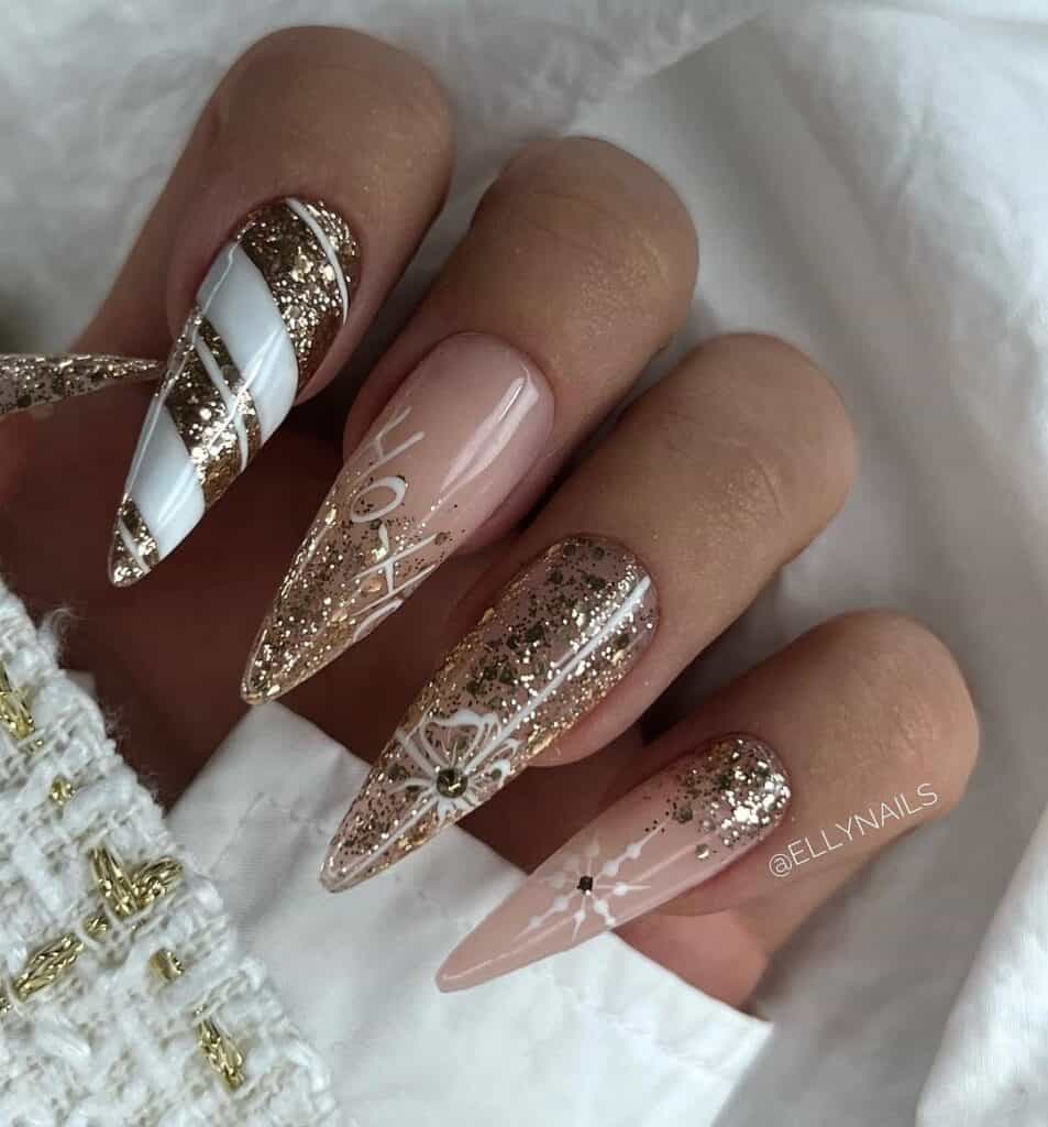 gold glitter christmas nails featuring white swirls snowflakes and ho ho ho text