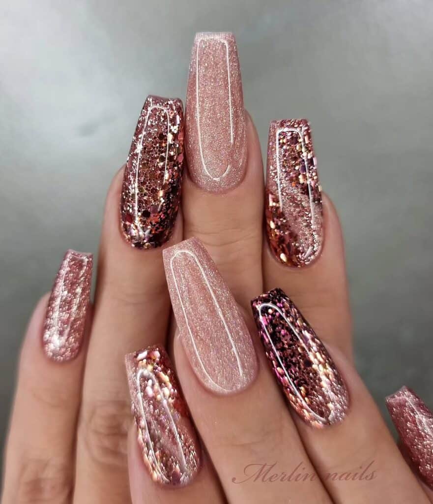 long coffin nails with rose gold and bronze chunky glitter accents and fine shimmer