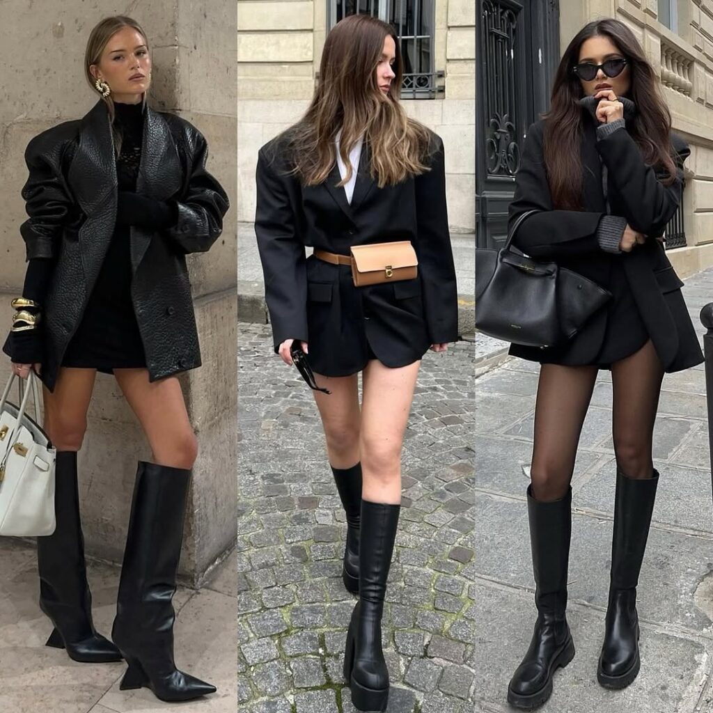three women wearing 2026 fashion trends with oversized black blazers and tall leather boots