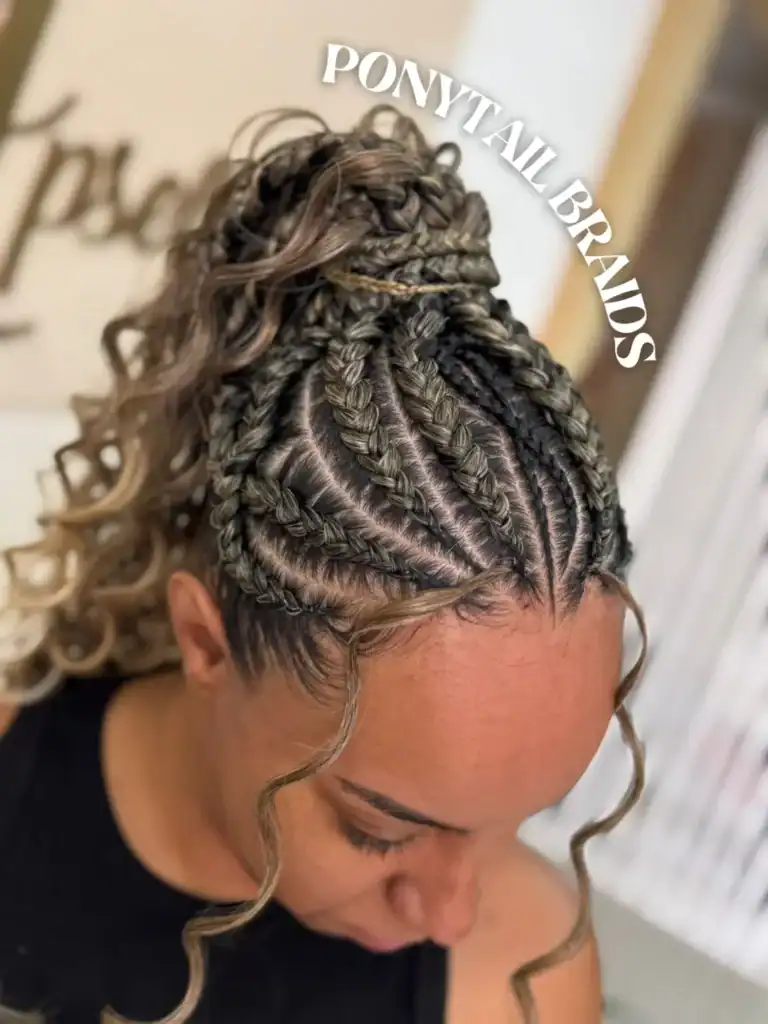 close up of textured feed-in braids styled into a high curly ponytail