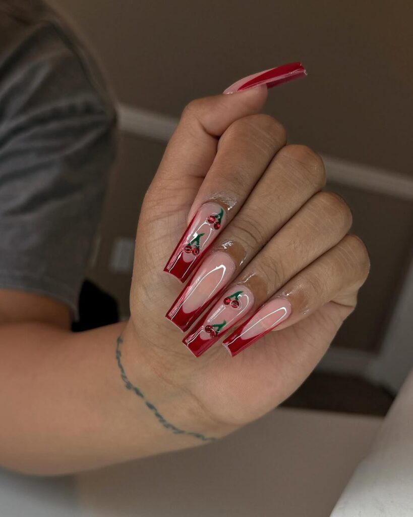 long square cherry coke nails with deep red french tips and cherry art