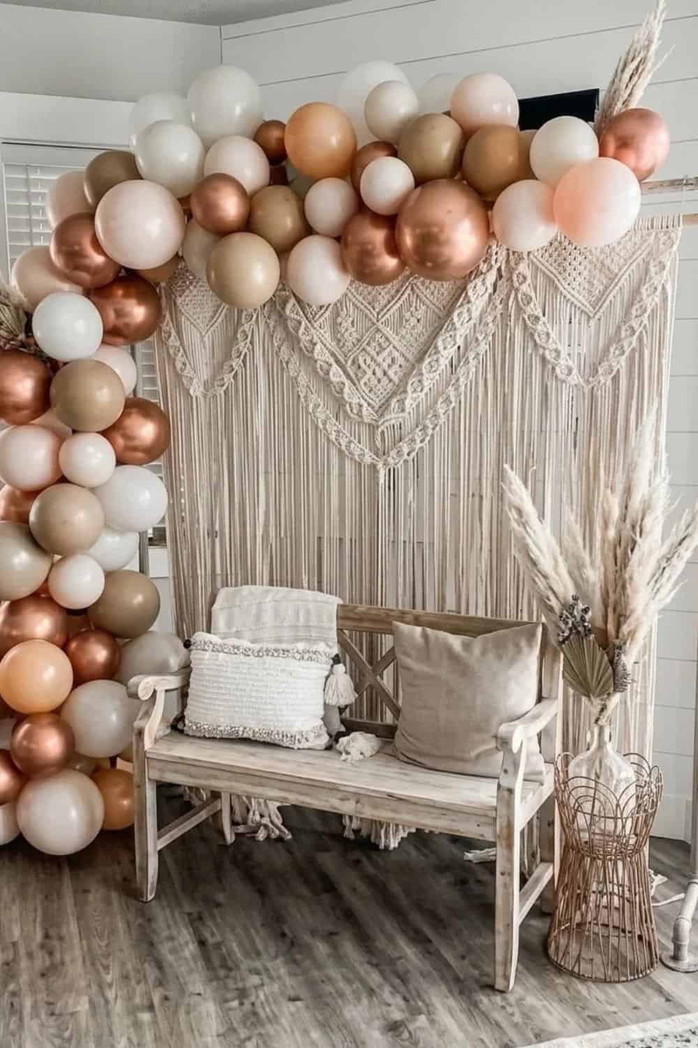boho bridal shower backdrop with macrame and brown and copper balloons.