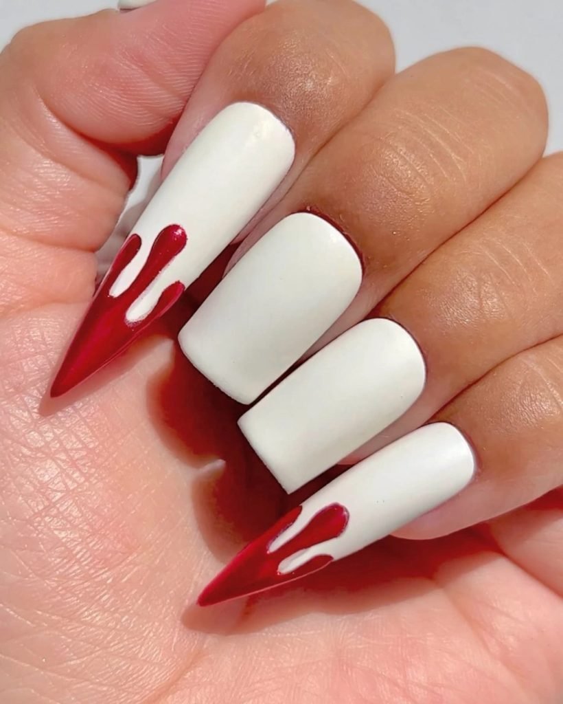 white square and stiletto shaped halloween nails with red dripping blood art accents