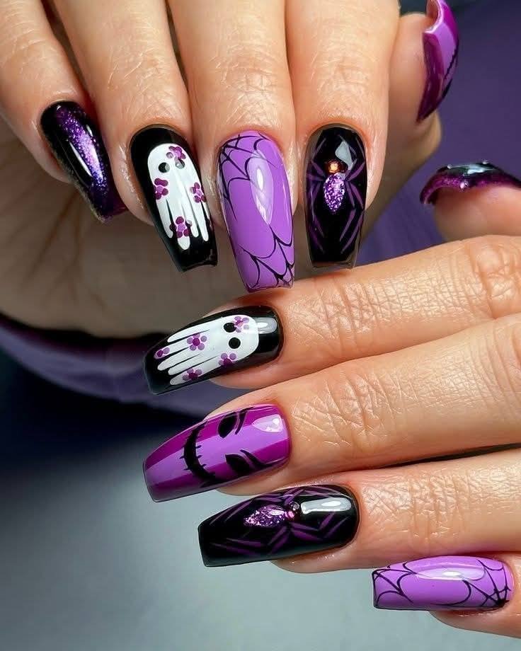 purple and black coffin nails with ghosts spiders spiderwebs and a scary face