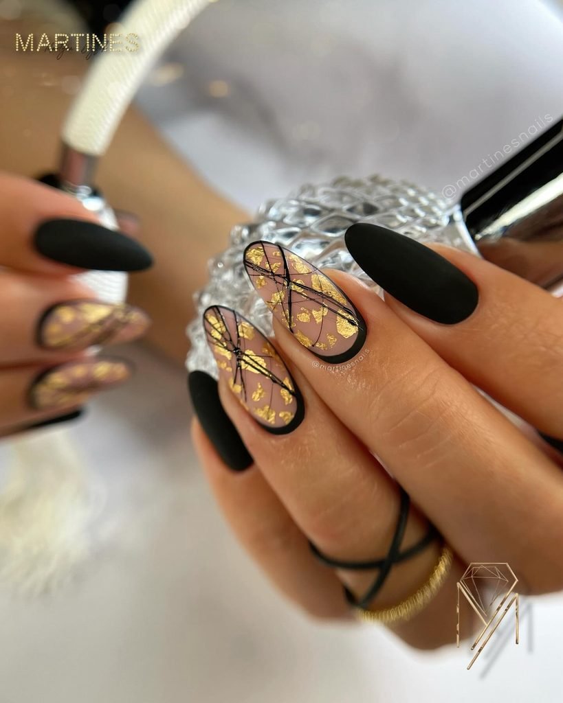 matte black stiletto nails mixed with nude and gold foil abstract line art