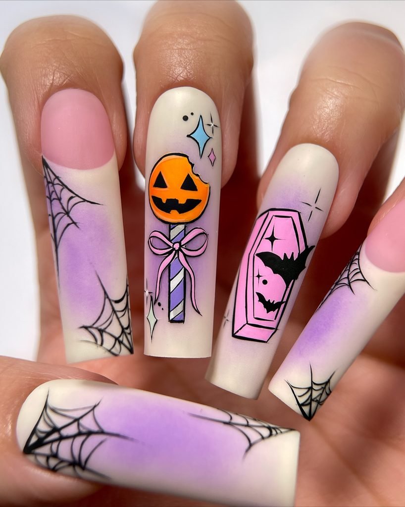 long square purple and white matte nails with spiderwebs a pumpkin lollipop and coffin