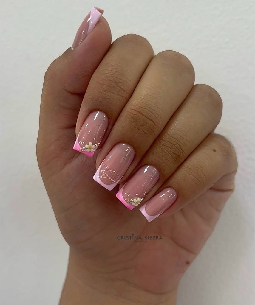 square french manicure nails with pink tips and small white flowers