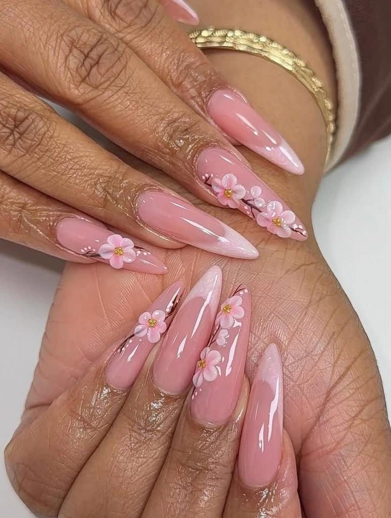 long almond-shaped pink manicure with white french tips and 3d floral nail art