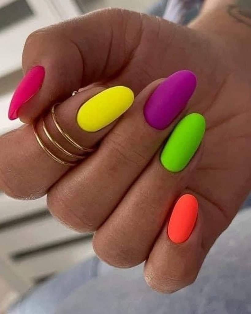 vibrant matte neon manicure with bright pink yellow purple green and orange polish