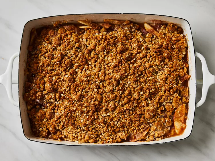 baked apple crisp with oat crumble topping in a baking dish
