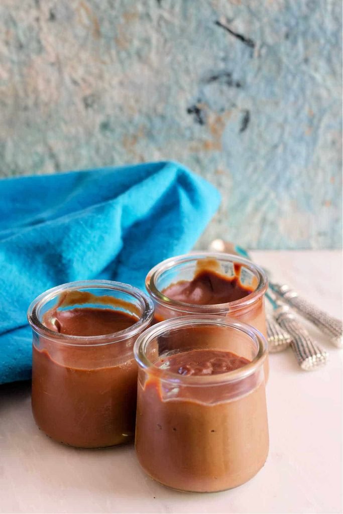 creamy chocolate caramel pudding served in small glass jars