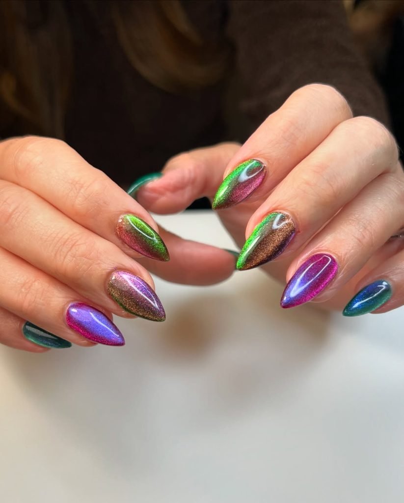 chameleon multicolor cat eye nails shifting green purple and pink on stiletto fingertips