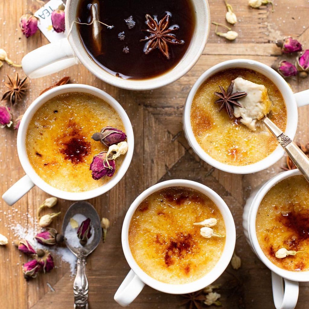 chai spice creme brulee cups topped with dried flowers and star anise