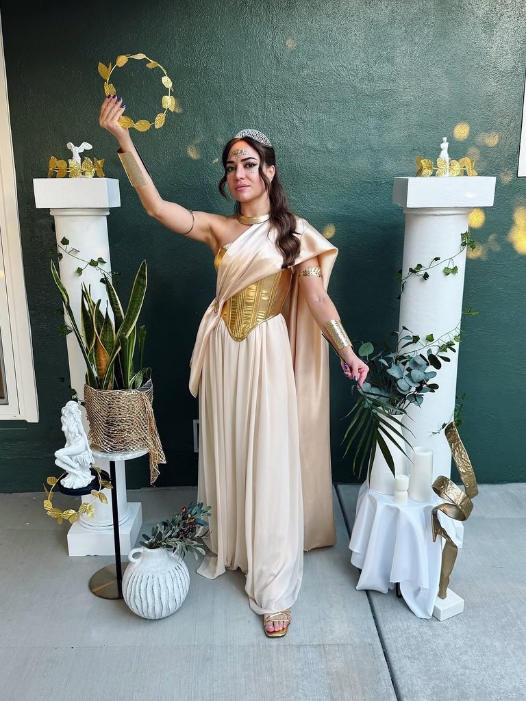Woman in a greek goddess halloween costume