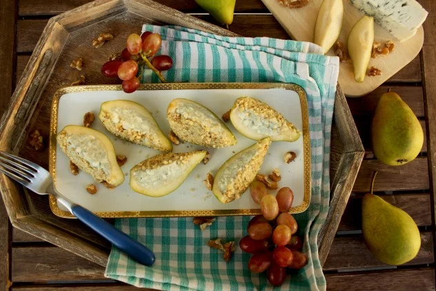 pear and blue cheese bites stuffed with walnuts and served with fresh red grapes