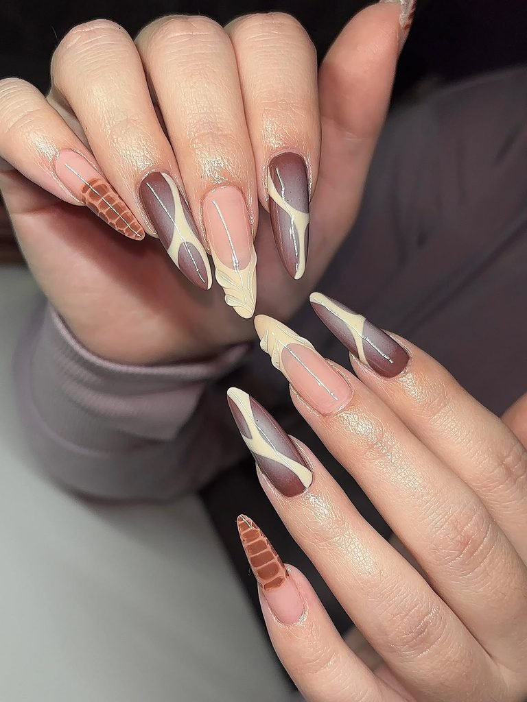 long stiletto nails with brown and nude abstract art and crocodile print