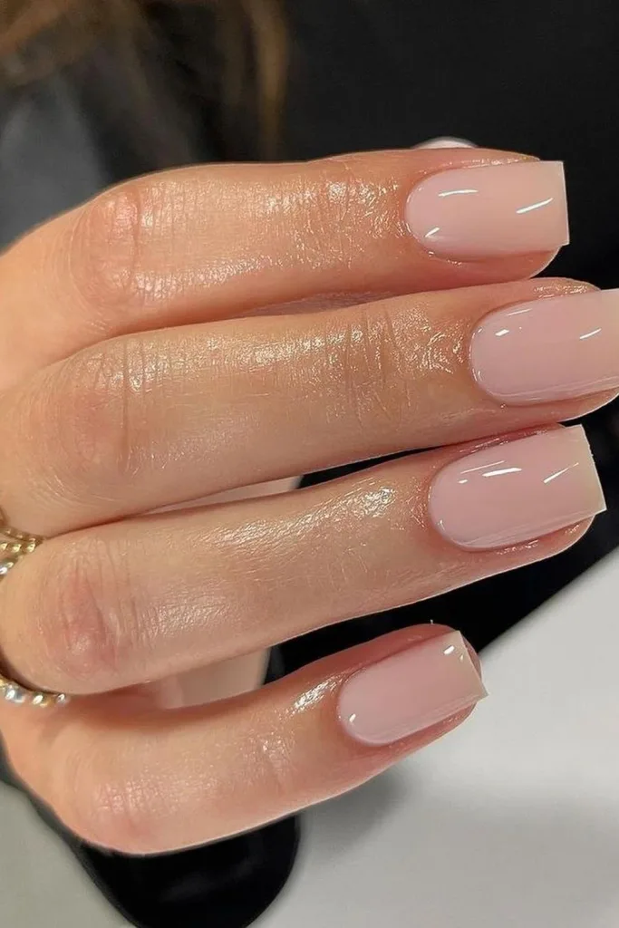 classic nude pink glossy square nails close up