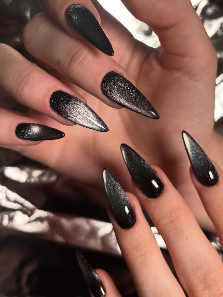 long stiletto nails with black magnetic cat eye glitter effect