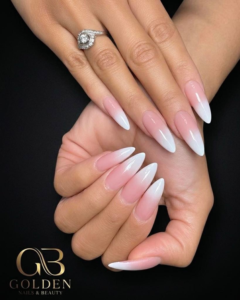 almond french ombre nails blending soft pink bases into milky white tips