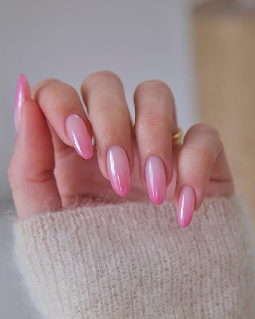 pink ombre almond nails fading from light nude to bright tips