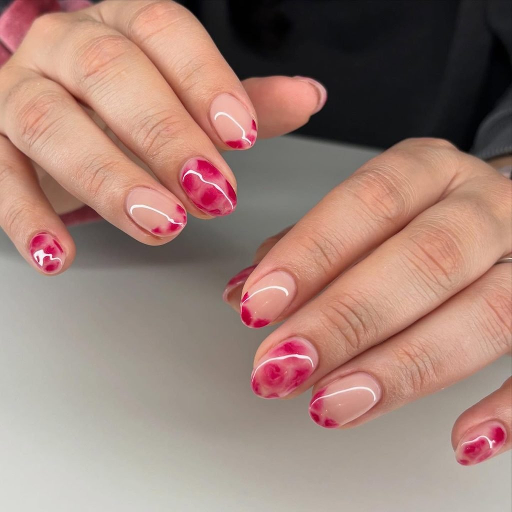 short oval nails with pink and red blooming gel marble nail art